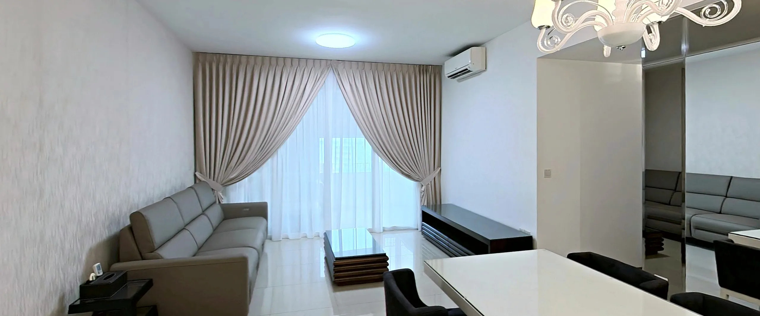 A sample flat: the living room, with the dining table in front